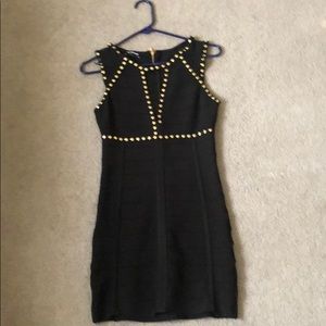 Black bandage dress with gold accents